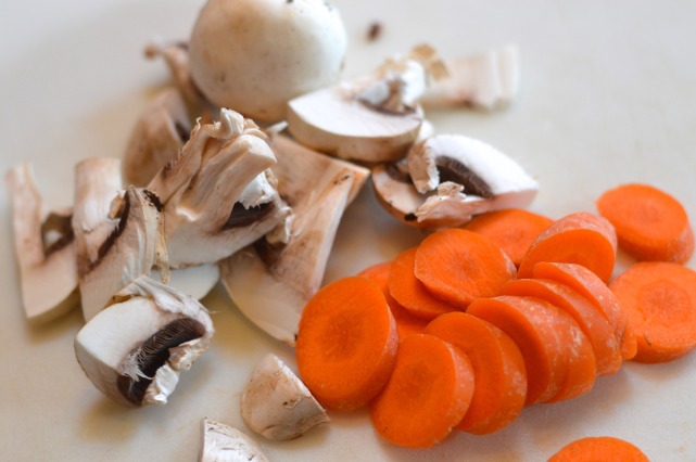 Cutting Mushrooms and Carrots for Stew